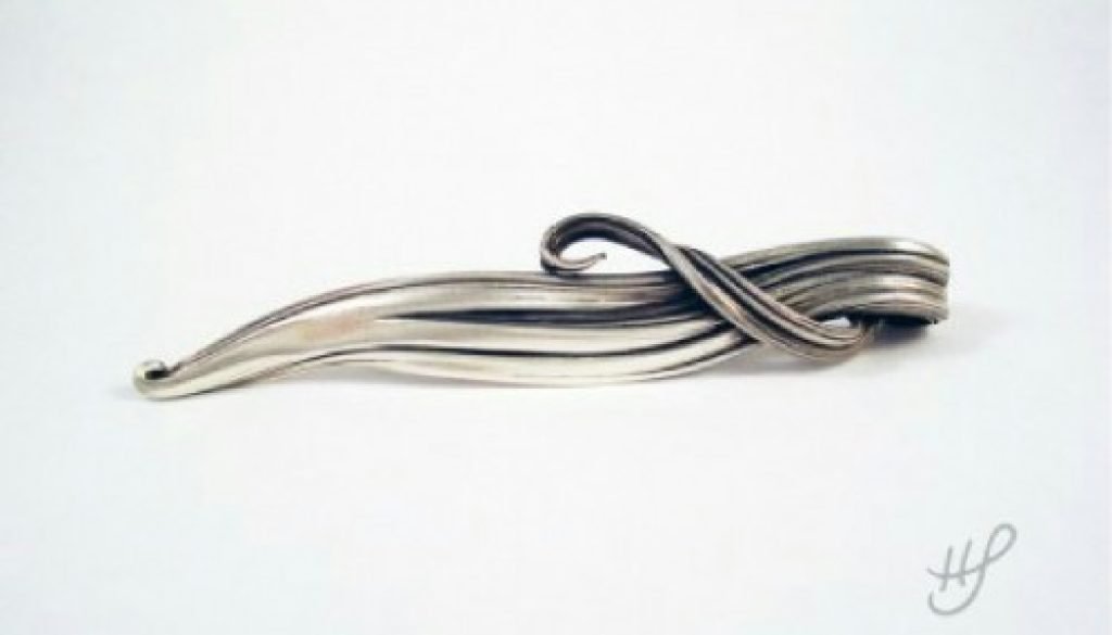 Silver Pendant with a Flowing Shape